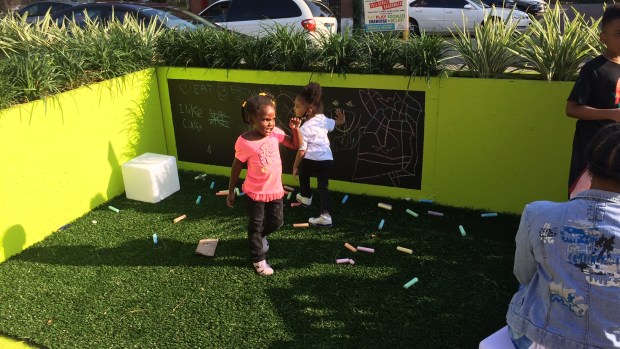 Converting parking to people space on 75th helps reenergize Black-owned restaurant strip